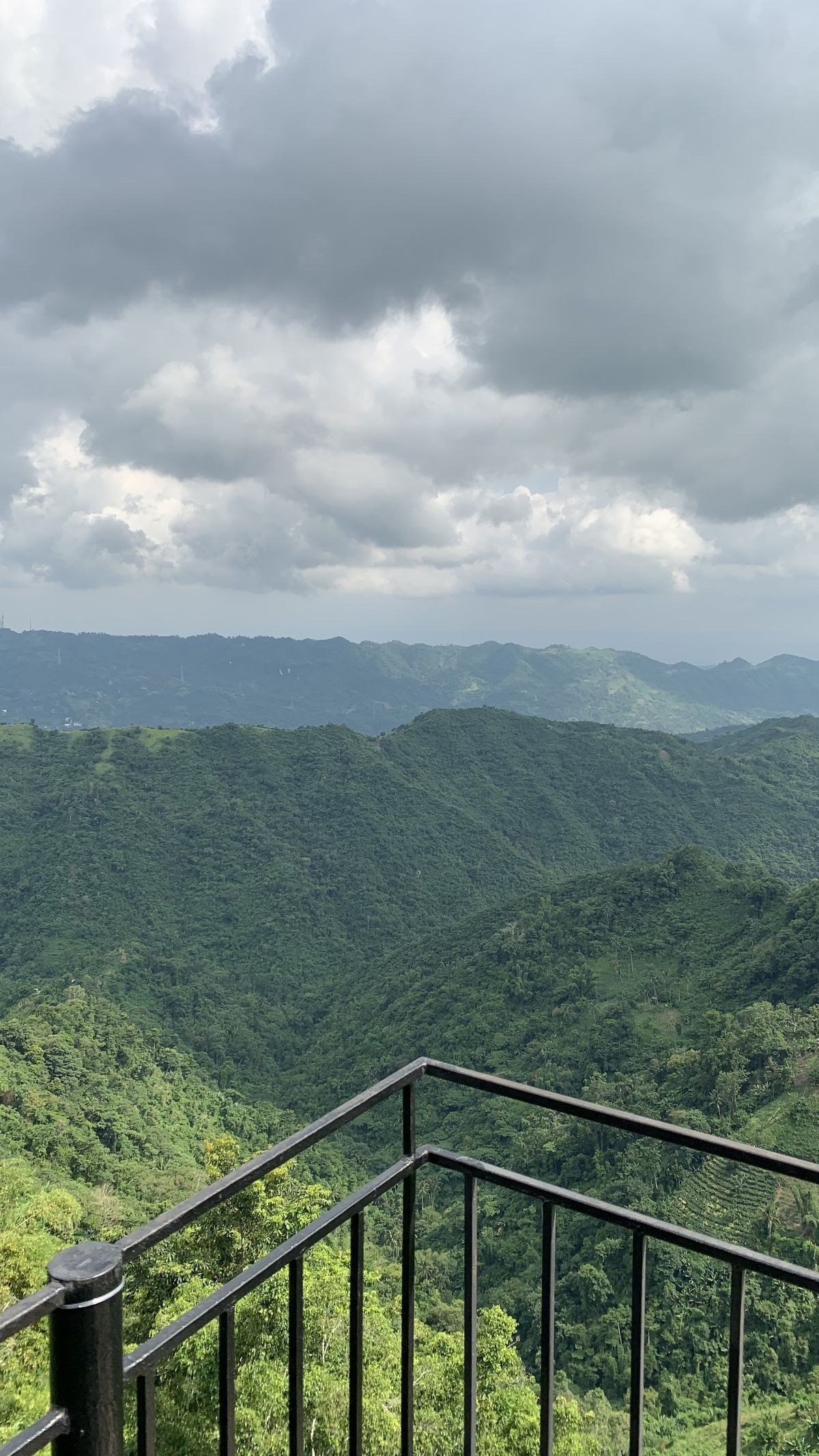 Green hills under a cloudy sky